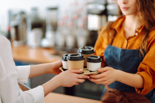 istock Female barista giving order to client 2068806230