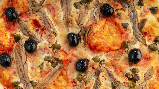 Pizza napoli with sardines, capers and olives. Italian pizza