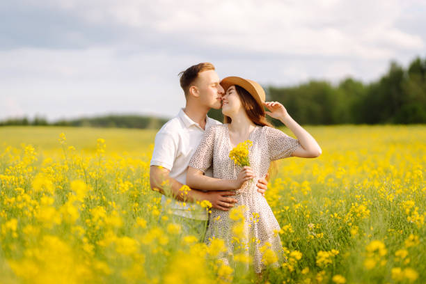 istock Young couple in love walks field. 2068830689