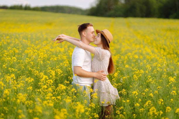 istock Young couple in love walks field. 2068830699