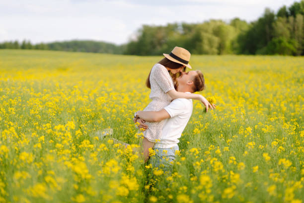 istock Young couple in love walks field. 2068830712