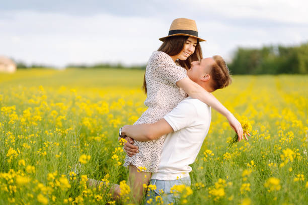 istock Young couple in love walks field. 2068830740