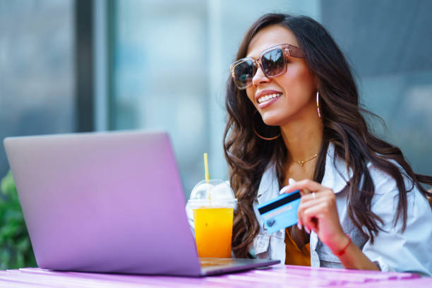 istock Young woman with laptop in cafe. 2068882793