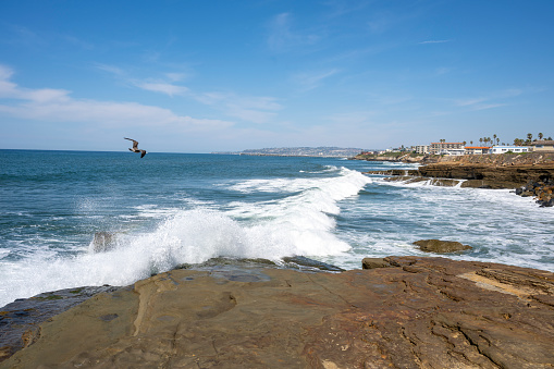 Aerial scenic view of rugged coastline and Pacific Ocean surf