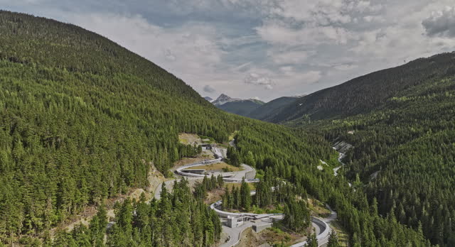 Whistler BC Canada Aerial v6 drone flyover the world-class sliding centre on the mountain surrounded by forested valleys capturing adrenaline pumping tracks - Shot with Mavic 3 Pro Cine - July 2023