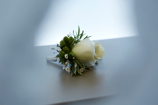 Closeup of white wedding roses on light romantic background with copy space