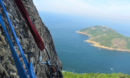 Climbing equipment on the rock wall of Morro Pão de Açucar in the city of Rio de Janeiro, Brazil