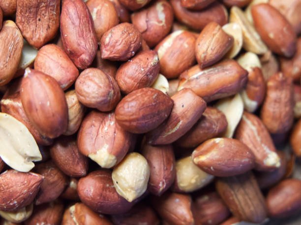 istock Roasted unpeeled peanuts macro, peanuts as a background. Peanut/Groundnut Texture 2068967423