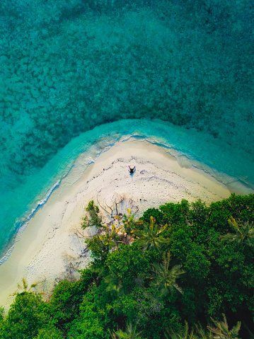 nishibama beach, kerama blue water and coral reefs at the kerama islands in okinawa, japan. drone point of view.