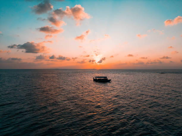 The Maldives is a tropical paradise located in the Indian Ocean, southwest of Sri Lanka and India. It is an island nation consisting of 26 atolls, which are made up of over 1,000 coral islands. Known for its stunning natural beauty, crystal-clear turquoise waters, and pristine white-sand beaches, the Maldives is a popular destination for honeymooners, divers, and travelers seeking luxury and relaxation.Here are some key features of the Maldives:Overwater Villas: The Maldives is famous for its luxury resorts, many of which offer overwater villas perched on stilts above the ocean. These villas provide guests with breathtaking views, direct access to the water, and the ultimate in privacy and seclusion.Diving and Snorkeling: The Maldives is home to some of the world's most spectacular coral reefs and marine life. Divers and snorkelers can explore vibrant coral gardens, encounter colorful fish, turtles, sharks, and rays, and even have the chance to spot whale sharks and manta rays.Water Sports: In addition to diving and snorkeling, the Maldives offers a wide range of water sports activities, including kayaking, windsurfing, paddleboarding, and sailing. Visitors can also enjoy jet skiing, parasailing, and flyboarding.Luxury Resorts: The Maldives is known for its luxury resorts, many of which feature world-class amenities, fine dining restaurants, spa facilities, and personalized service. These resorts cater to travelers seeking a high-end and exclusive experience.