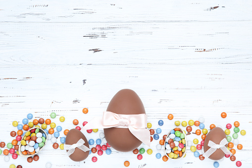 Easter. Closeup of colorful sugar eggs on a green synthetic grass.