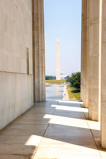 Colonnade at Lincoln Memorial in Washington, D.C. Lincoln Memorial Reflecting Pool and Washington monument shown on background