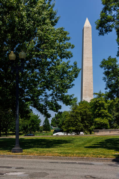 istock Washington Monument covered by trees in summer Washington, D.C. 2069010557