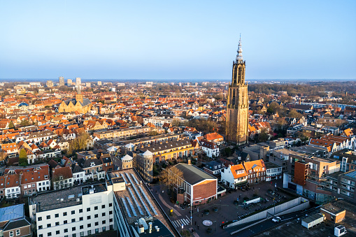 Aerial view of Amersfoort at spring season with the Lieve Vrouwe Tower, The Netherlands, Town Skyline\nHigh resolution image created with the 48mp drone DJI Mini 3 Pro