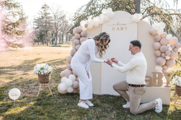 istock A man proposes to his girlfriend and puts an engagement ring on her hand 2069071725
