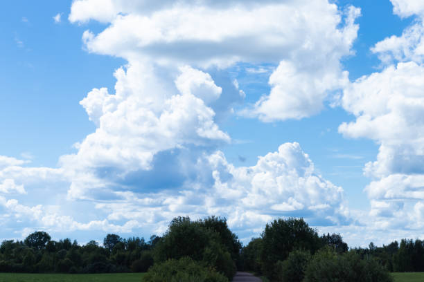 blue background of the summer sky with clouds.