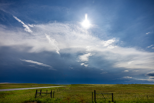 The sun shining over a building storm cloud in Nebraska
