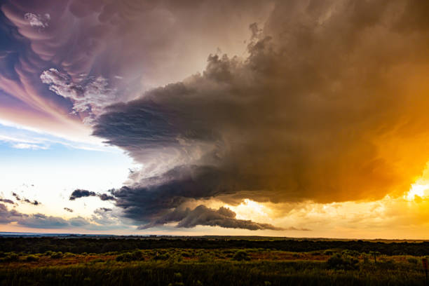 istock Dramatic sunset  and corkscrew storm cloud over a field in western Nebraska 2069097427