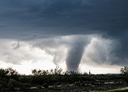 A huge dark cloud with a swirling funnel in southwest Texas