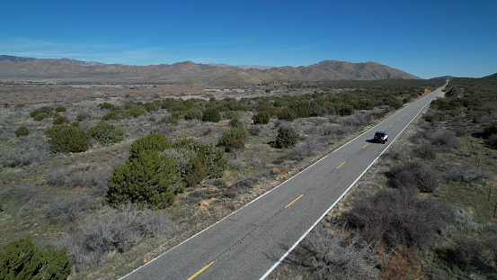 Aerial view of highway on the Mojave desert and blue sky