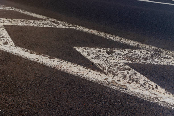 istock old road markings on the highway in winter 2069125578