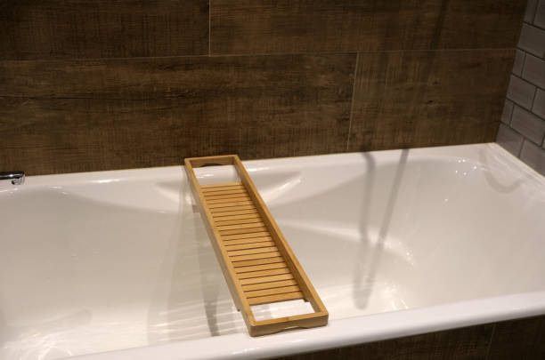 istock wooden shelf on white bathtub 2069132988