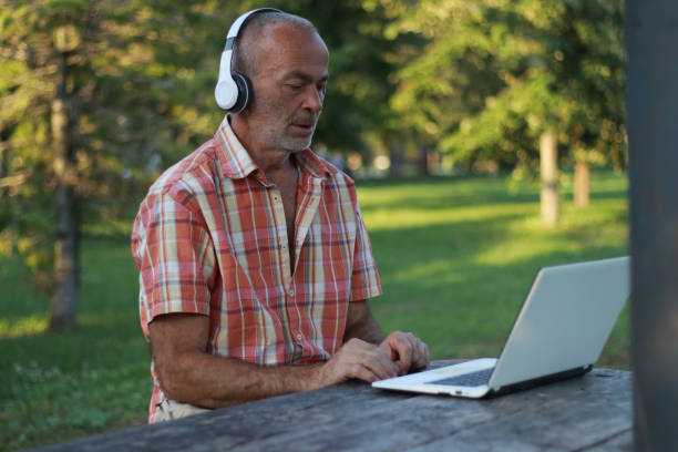 istock Mature and relax man working in nature 2069140211