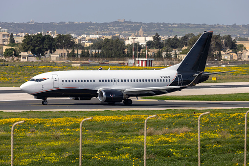 Luqa, Malta - March 8, 2024: 2Excel Aviation Boeing 737-3L9 (Reg: G-SWRD) departing runway 31 after 2 days in Malta.