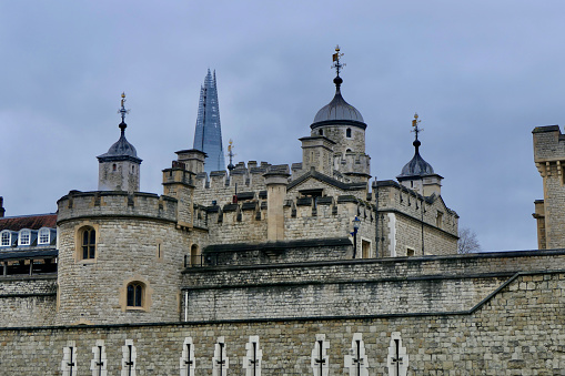 The tip of the Shard is an odd addition to this otherwise medieval skyline formed by the Tower of London.