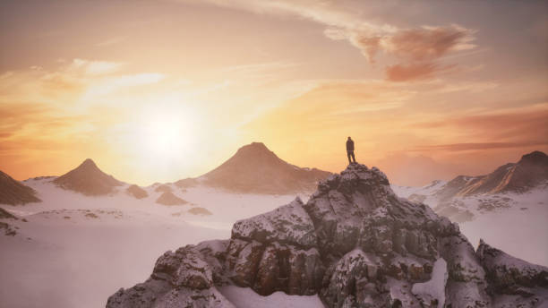 istock Adventurous Man Hiker on a snowy peak. Snow covered mountain view. 2069183384