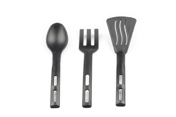 istock Black plastic kitchen spatula and spoon isolated on white background 2069221481