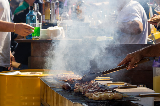 Street party with grilled meat skewers (souvlaki) at Smokey Thursday (Tsiknopempti) in Limassol, Cyprus