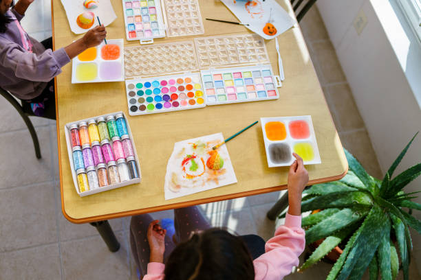 istock Sisters use watercolor paints at home 2069282557