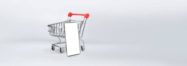 istock shopping cart with a modern smartphone on white background - easy modification 2069287321