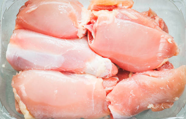 istock Raw boneless chicken thighs lie in a transparent plastic package 2069306219