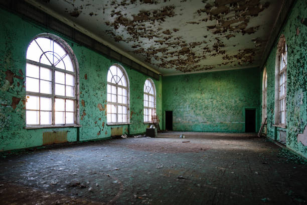 istock Large hall of abandoned building with peeled paint 2069357926