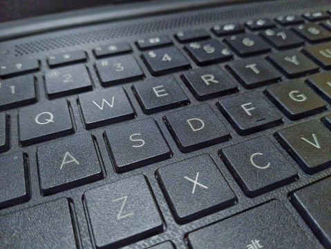 black computer keyboard with embossed numbers displayed