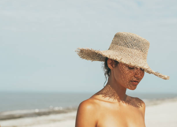 istock Beach Woman in Sun Hat During Summer Vacation 2069437114