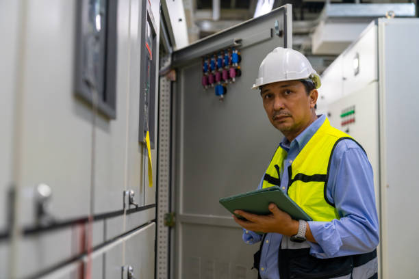 istock Asian man engineer working at factory server electric control panel room. 2069451859