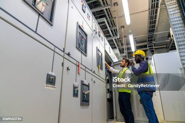 Electrical Control Server Male Engineer Teamwork Working At Factory Server Electric Control Panel ...