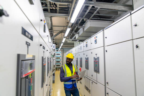 istock African man engineer working on laptop at factory control room. 2069452747