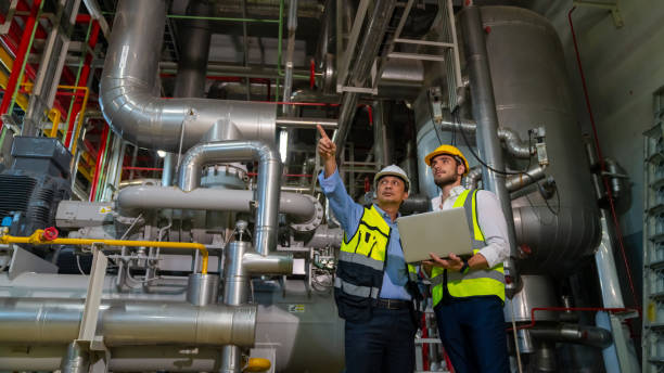 istock Male engineer teamwork working together at factory site control room 2069453777