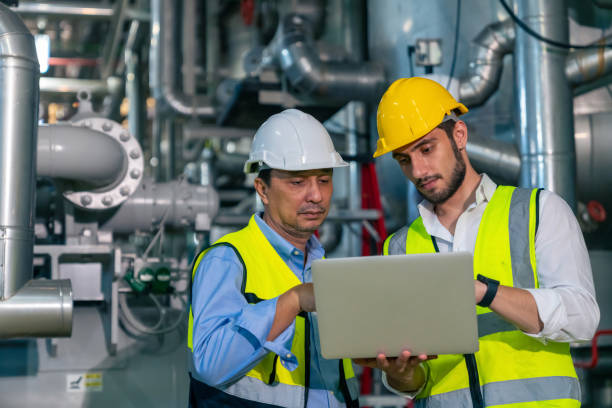istock Male engineer teamwork working together at factory site control room 2069453778