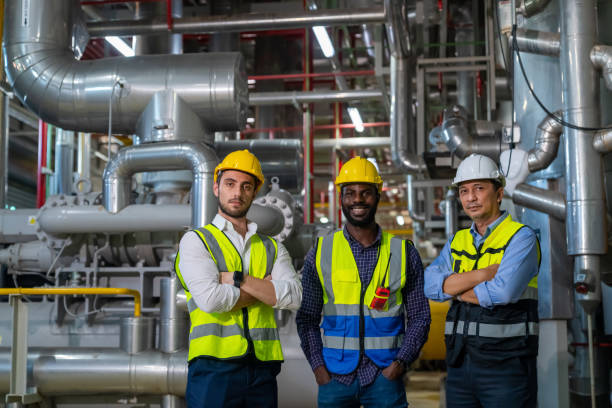 istock Group of Male engineer teamwork working together at factory site control room. 2069453792