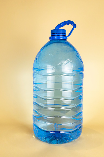 A large plastic bottle of drinking water of 5 liters. A bottle of water. The concept of quenching thirst in summer