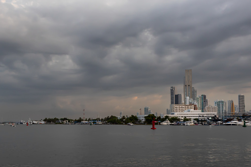 city buildings from the caribbean sea as rain approaches