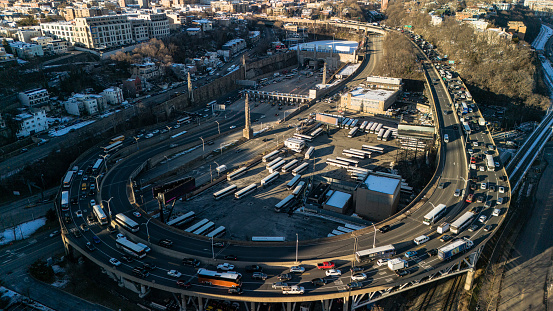 Bustling Lincoln Tunnel exit with cars and commute vehicles entering the Weehawken in New Jersey