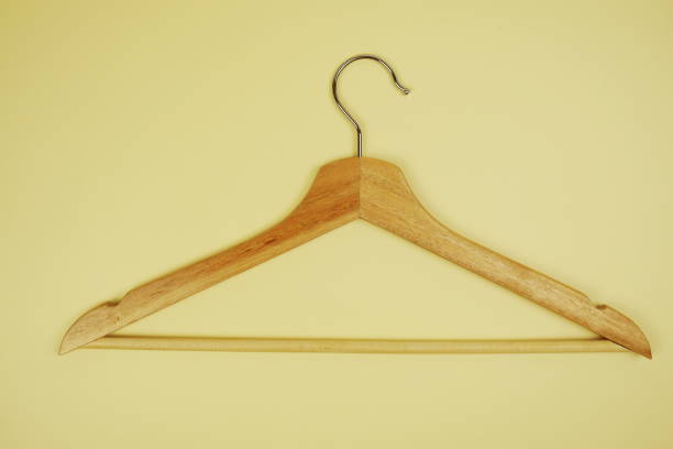 istock Wooden hanger top view on yellow background 2069739958