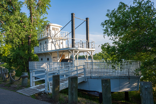 Bismarck, USA - June 10, 2023. Historic boat at Steamboat Warehouse State Historic Site on Missouri River, Bismarck, North Dakota, USA