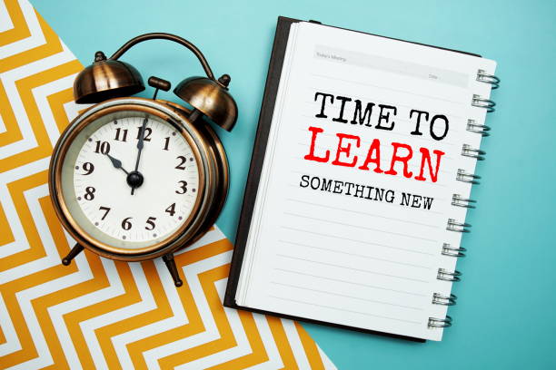 istock Time to learn something new text on notepad paper and alarm clock 2069788485